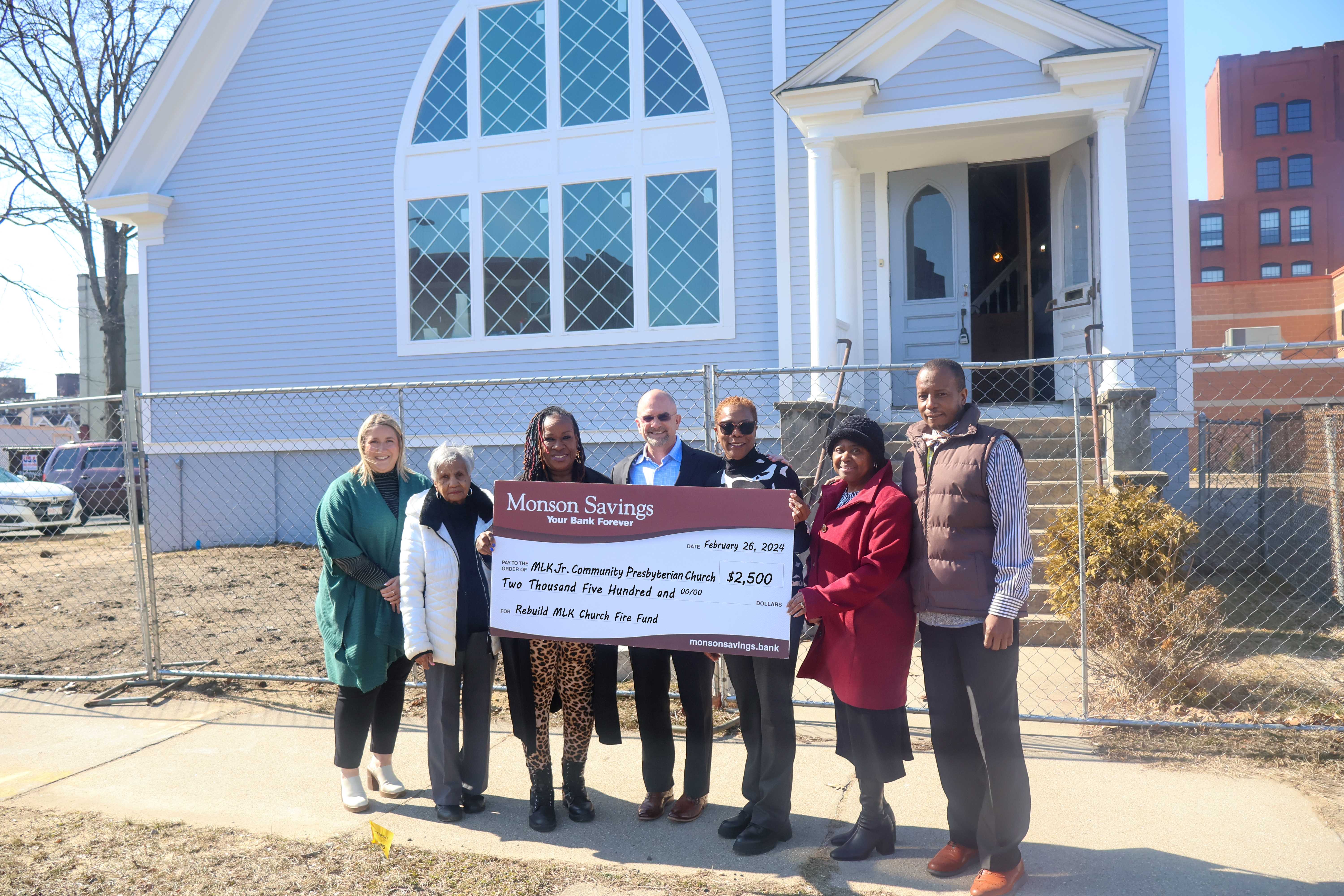 Dan Moriarty, Monson Savings Bank President & CEO (center), and Kylie LaPlante, Monson Savings Bank AVP Business Development Officer (far left), presented the donation to The Reverend Dr. Terrlyn L. Curry Avery (center right) and church board members.