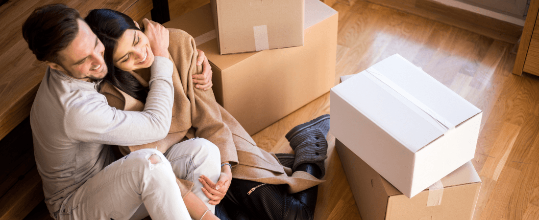 A young couple moving in