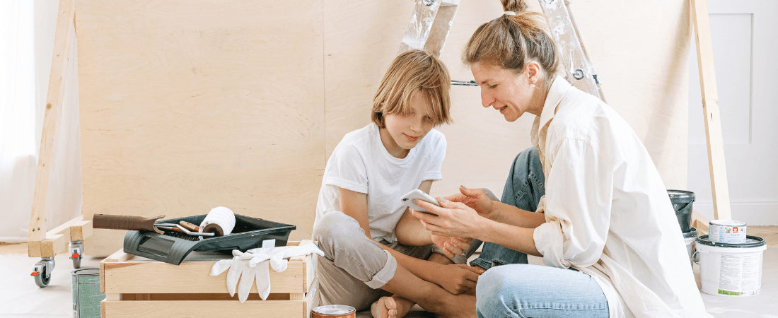 Woman with her son working on home