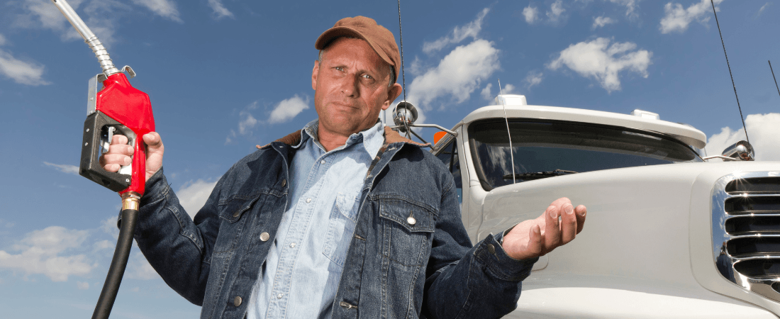 Man shrugging with gas pump