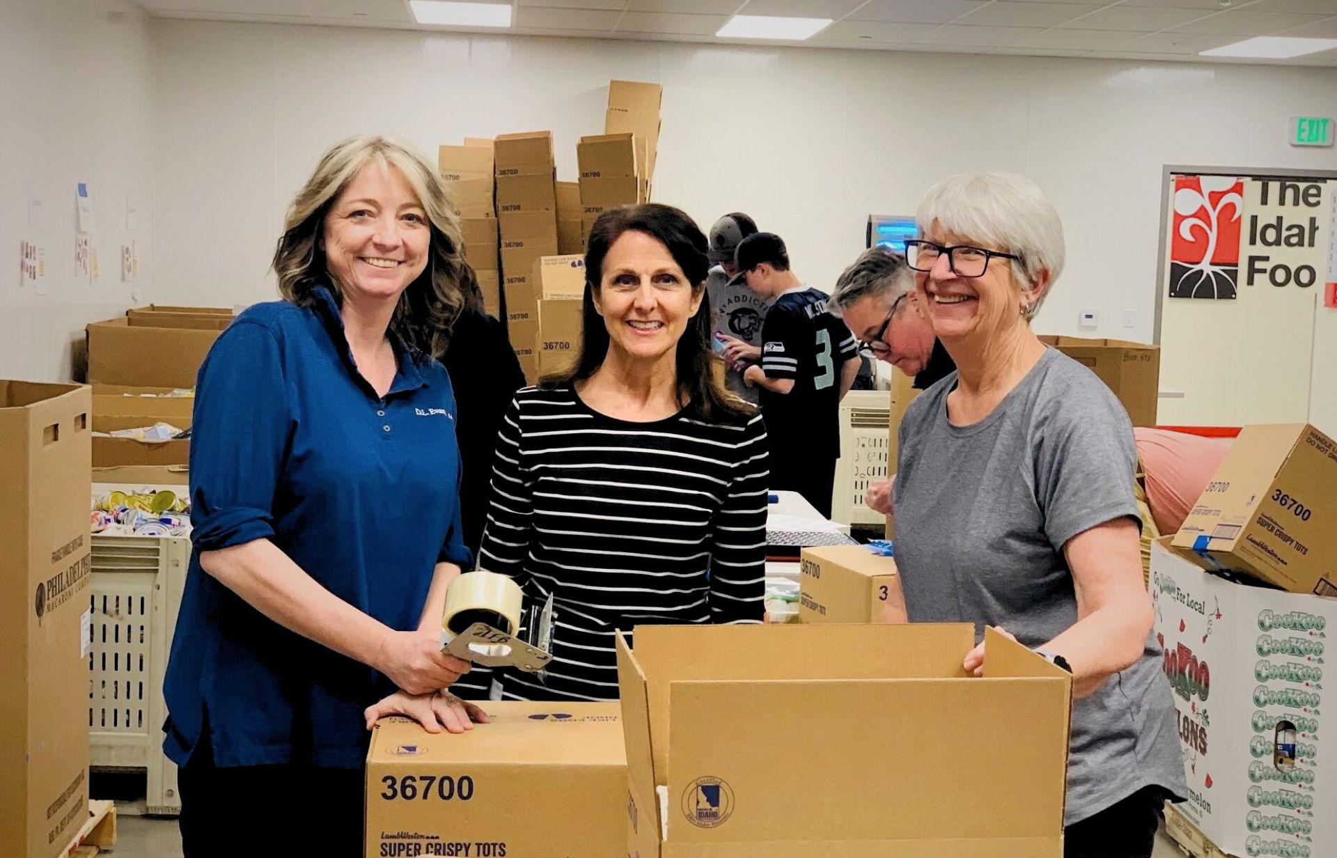  D.L Evans Bank employees volunteering at the Idaho Food Bank in Boise, ID.  