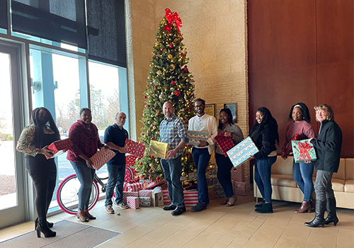 FIRST HARVEST CREDIT UNION CHARITABLE JOURNEY COMMITTEE  DELIVERS GIFTS TO FAMILIES IN NEED