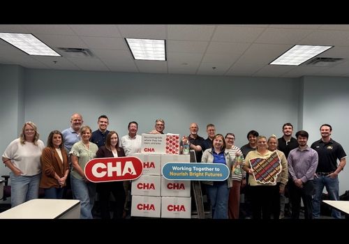 Sutton Bank Employees Assist with Packing Meals for Children In Need
