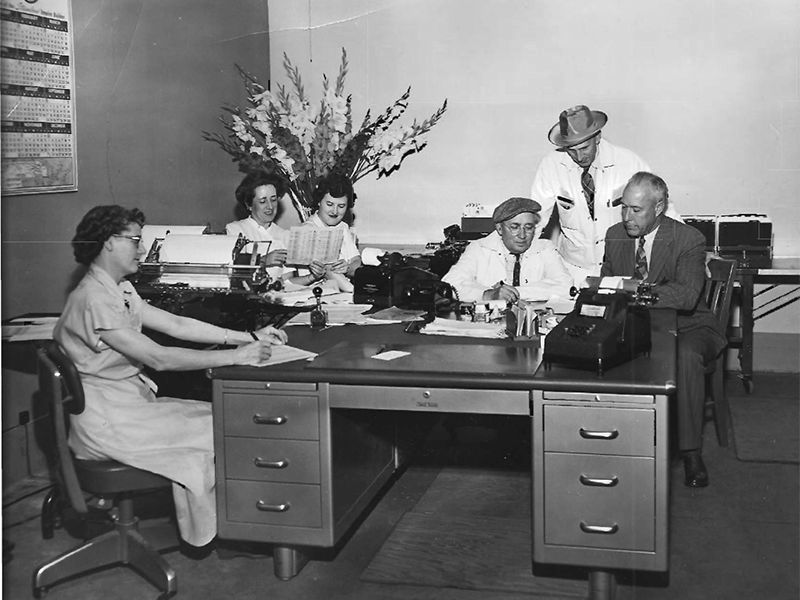 The Accentra Credit Union (Hormel Employees Credit Union) opened on December 1, 1930 and was located in the Hormel Plant. This photo was taken in 1950 when there were six staff members and total assets reached $2 million.